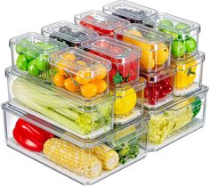 several plastic containers filled with different types of fruits and vegetables in each container are stacked on top of each other