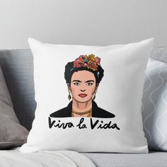 the frida throw pillow on a couch