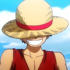 a woman wearing a straw hat and red shirt with blue sky in the back ground