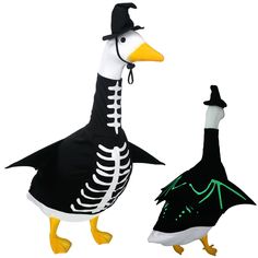 two ducks dressed up in halloween costumes, one with a skeleton on it's head