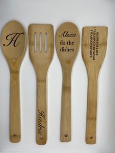 three wooden utensils with engraved names and spoons in the shape of spatulas