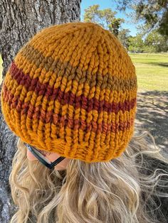 The Mia Beanie is a ribbed style knitted hat that is very cozy. It is made with think chunky wool and acrylic yarn. The color combination I chose looks like the 70's, with the burnt orange and greens and yellows together. I love it! It is very soft and the more you wear and wash it, the softer it will get. This yarn is meant to last forever. Chunky Wool, Vintage Theme, 70s Retro, Knitted Hat, Skull Cap Beanie, Knit Hat, Skull Cap, Color Combination, Acrylic Yarn