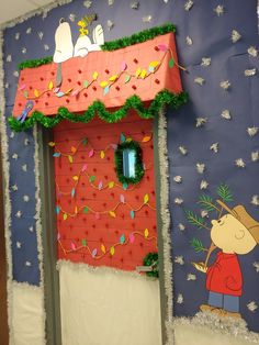 a door decorated to look like a house with decorations on the front and side walls