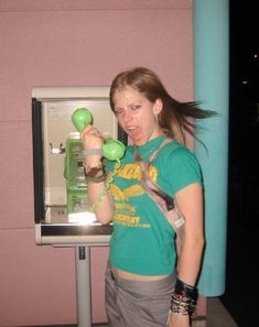 a woman standing in front of an atm machine