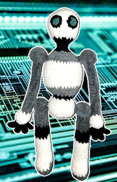 a close up of a stuffed animal in front of a circuit board