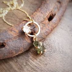 Genuine raw moldavite is set in a handcrafted prong and suspends from complimenting rose quartz adorned hoop. Strong but delicate cable 1.1mm chain. ~Moldavite <.5g ~4mm 5mm rose quartz ~Wrapped and ready for gifting or keeping ~Handmade in Tennessee Nature-inspired Jewelry With Raw Stone For Gift, Nature-inspired Raw Stone Pendant Jewelry, Raw Rose Quartz Necklace, Crossville Tn, Raw Rose Quartz, Rose Quartz Necklace, Raw Stone, Quartz Necklace, Heart Chakra