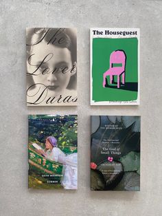 four different books on the wall with one showing a woman in a pink chair and another featuring an image of a person