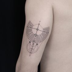 a man's arm with a tattoo on it that has geometric shapes and lines