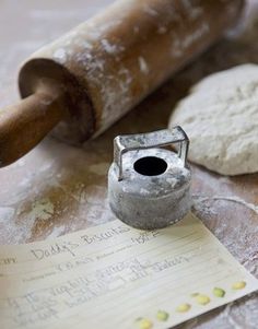 dough and rolling pin sitting on a table