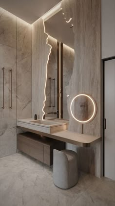 a modern bathroom with marble walls and flooring, lighted by an illuminated mirror above the sink