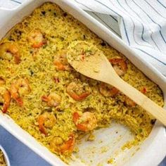 a casserole dish filled with shrimp and rice