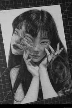 a pencil drawing of a woman with her hands on her face and two fingers in front of her face