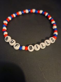 a red, white and blue beaded bracelet with the word buffalo on it's side