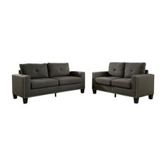 two gray couches sitting next to each other