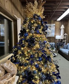 a blue and gold christmas tree in an office