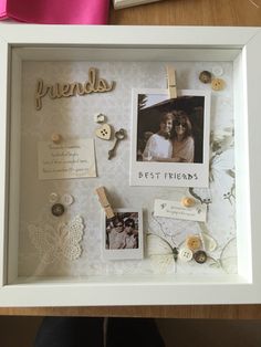 a white frame with pictures and buttons attached to it