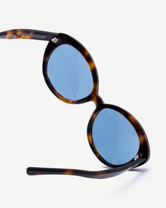 The FRANCES is a fun, oversized, rounded frame that exudes a 1970s beach look that can reach the streets. The tortoise frames are paired with colored lenses for a standout look. Retro Tortoiseshell Cat Eye Sunglasses With Tinted Lenses, Retro Blue Cat Eye Sunglasses, Retro Blue Sunglasses With Gradient Lenses, Retro Sunglasses With Tinted Lenses For Vacation, Retro Blue Polarized Sunglasses, Retro Blue Sunglasses With Polarized Lenses, Retro Blue Wayfarer Sunglasses, Retro Wayfarer Sunglasses For The Beach, Vintage Mirrored Sunglasses For Vacation