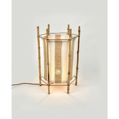 a lamp that is made out of bamboo sticks