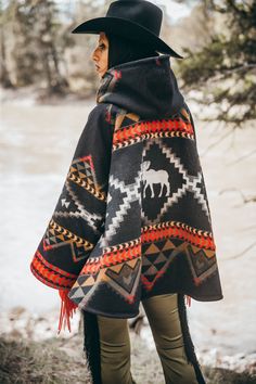 Most Orders Ship within 1-2 Business Days Fully lined bell-shaped hooded cloak with welt patch pockets and three toggle closure. Valentine is 5'11" and wears size OS. Unnapped Pendleton blankets: 82% Wool, 18% Cotton. Wool Cashmere facings and Silk Rayon peachskin lining. Lost Trail Pass traverses the border of Idaho and Montana, high in the Bitterroot Mountains. It was near here that the Lewis and Clark Corps of Discovery crossed into the Bitterroot Valley in September 1905, after successfully Bitterroot Mountains, Pendleton Blankets, Pendleton Blanket, Sweat Dress, Hooded Cloak, Lewis And Clark, Blanket Designs, Cotton Wool, Cloak