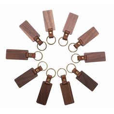 eight wooden key chains arranged in a circle