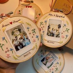 two hand embroidered pictures with family photos on them