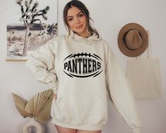 "Panthers Hoodie, Panther Football Hoodie, Panther Baseball Hoodie, Panther Mascot Hoodie, Panthers Shirt   Hi! Welcome to✨Northstar Sweatshirt &Hoodies✨ ✨As the weather gets colder, you want clothes that keep you and your body warm. Here, Northstar Sweatshirt &Hoodies is ready to keep you warm with its unique designs. These soft and cotton sweatshirts and hoodies can be combined with anything.✨ ✨Product Features✨ 👉Medium-heavy fabric (8.0 oz/yd² (271.25 g/m 👉Loose fit 👉Runs true to size 👉50 Fall Fan Gear Hoodie With Letter Print, Fall Fan Apparel Hoodie With Letter Print, Fan Gear Long Sleeve Hoodie With Adjustable Hood, Game Day Winter Hoodie Sweatshirt, Fall Fan Apparel Hoodie With Adjustable Hood, Game Day Fall Hoodie, Fall Fan Apparel Hoodie With Ribbed Cuffs, Football Aunt, Panther Shirts