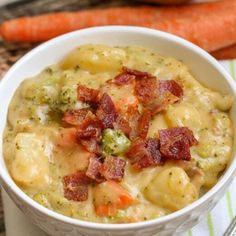 a white bowl filled with potatoes and bacon