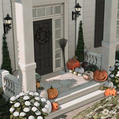 a house with pumpkins on the front porch