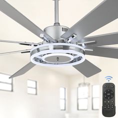 a ceiling fan with remote controls in front of it and an image of a tv on the wall