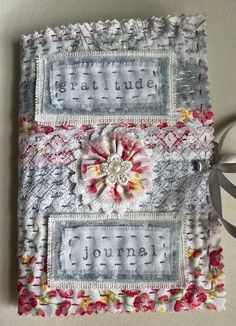 a close up of a piece of cloth with flowers on it and the words grateful