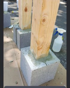 two cement blocks are stacked on top of each other and one has a spray bottle in it