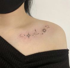 a woman's chest with stars and the word love written on it, in black ink