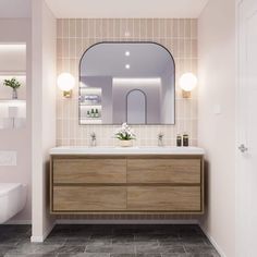 a bathroom with a sink, mirror and toilet in it's center wall area