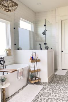 a bathroom with a bathtub, sink and toilet in it's center area