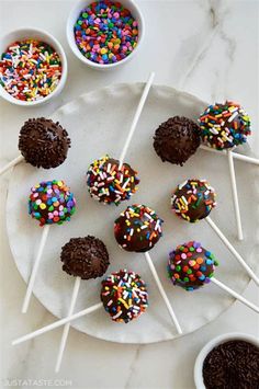 chocolate cake pops with sprinkles on a plate