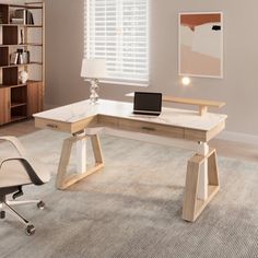 an office with a desk, chair and bookcase in the corner near a window