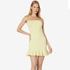 Susana Monaco Strapless Ruffle Hem Dress In Custard. Nwt, Size Xl. Still In Original Packaging. Perfect For The Beach Or Resort, The Susana Monaco Strapless Ruffle Hem Dress Is A Form-Fitting And Versatile Number You Need This Season. Strapless Dress Made With An Elastic Band To Stay In Place. Flowing Ruffle Hem. Pull-On Styling. 86% Nylon, 14% Spandex. Hand Wash, Dry Flat. Made In The U.S.A. Yellow Strapless Mini Dress For Date Night, Summer Mini Dress With Ruffle Hem And Straight Neckline, Chic Yellow Mini Strapless Dress, Strapless Stretch Sundress, Yellow Strapless Mini Dress For Summer, Spring Strapless Dress With Ruffles, Spring Strapless Dress With Ruffles And Straight Neckline, Spring Strapless Stretch Dress For Brunch, Strapless Flirty Sundress With Ruffles