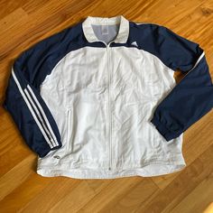 Men’s Size Xl Adidas Navy And White Warmup/ Windbreaker Jacket. Full Zip, 2 Front Zip Pockets, Elastic Cuffs On Sleeves. Excellent Condition, Never Worn White Adidas Windbreaker For Outdoor, Adidas White Windbreaker For Outdoor, White Long Sleeve Sport Coat, White Adidas Windbreaker For Outdoor Activities, Adidas White Windbreaker For Outdoor Activities, Adidas White Outerwear For Outdoor, White Adidas Outdoor Outerwear, Adidas White Outdoor Outerwear, Blue Windbreaker