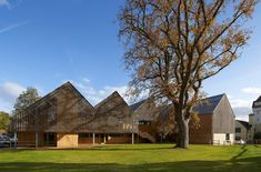 the building is made out of wood and has triangular shaped windows on it's sides