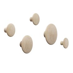 three wooden knobs are shown on a white background