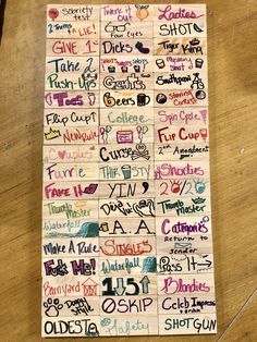 a wooden table topped with lots of different types of writing on it's sides