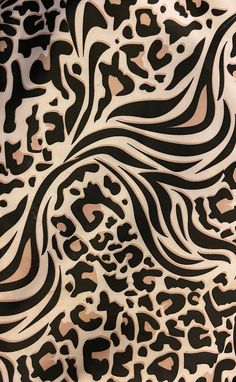 an animal print fabric with black and white designs