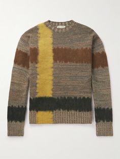 a sweater with multicolored stripes on it