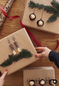 two women are wrapping presents under the christmas tree