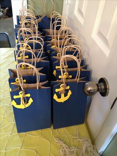 blue bags with yellow anchors tied to them