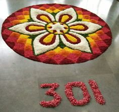 a red and yellow flower rug with the number 1033 written in front of it