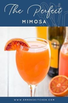 the perfect mimosa is served in a glass with an orange slice on top