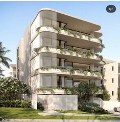 an apartment building with balconies and plants on it