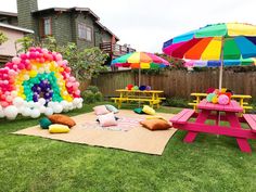 an outdoor party with balloons and picnic tables in the back yard for children's birthdays