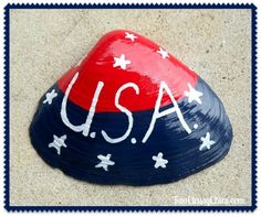 a red, white and blue hat with the word usa painted on it